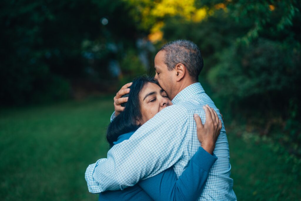 man hugging a woman in support