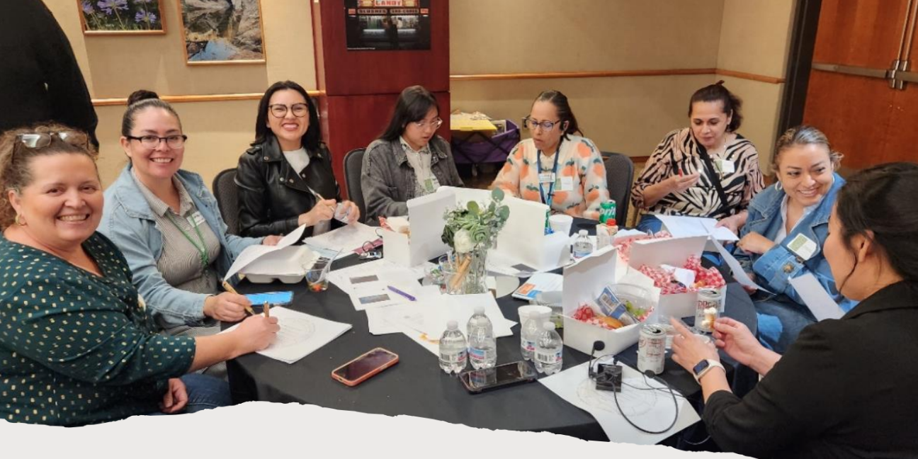 Joining Forces 2025 Ladies sitting around a table at a Conference